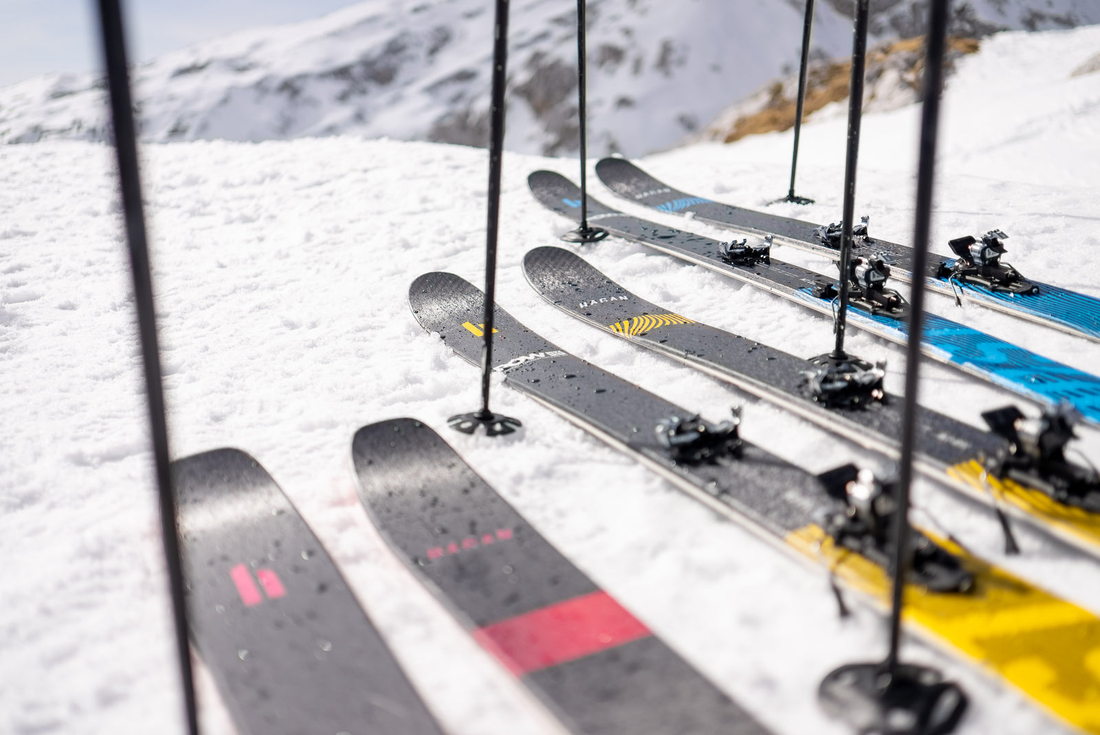 HAGAN Boost Skis laying in the snow.