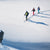 Kids ski touring with Hagan backcountry skis traversing a snow field